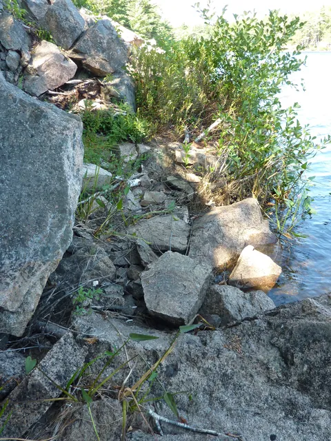 Stacked flat stones and boulders at the top of the talus
