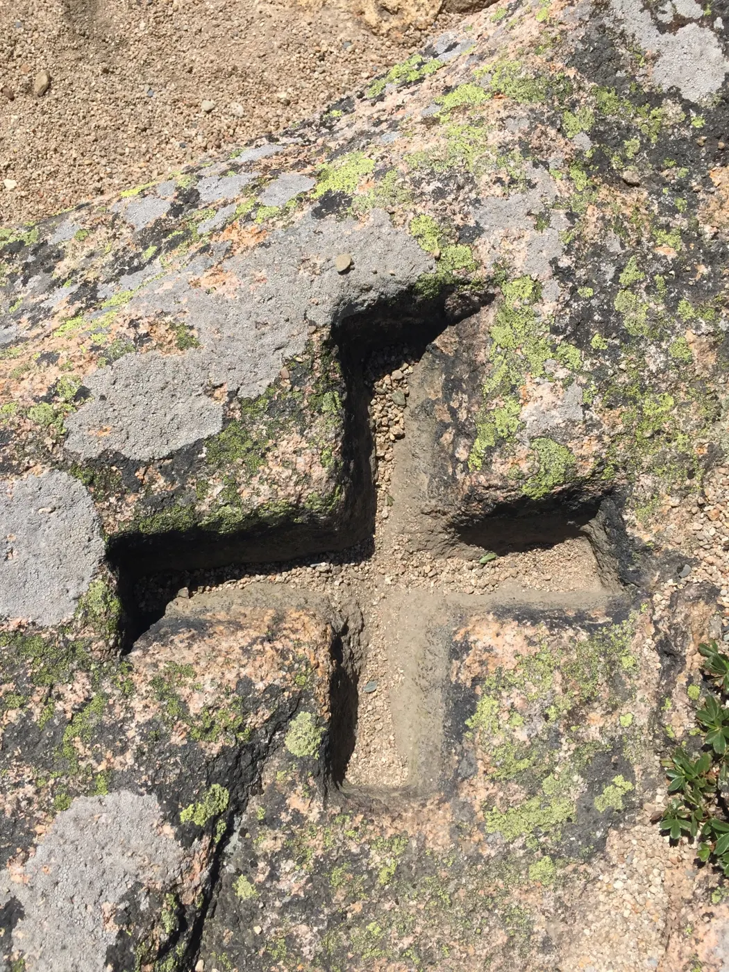A cross cut into granite ledge