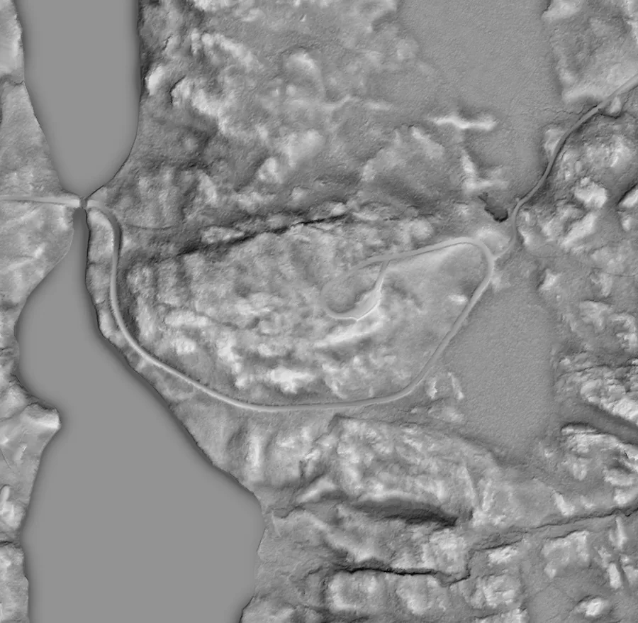 Grey LiDAR hillshade of Pine Hill, with the teardrop-shaped parking loop on the hilltop and the fire road curving around it